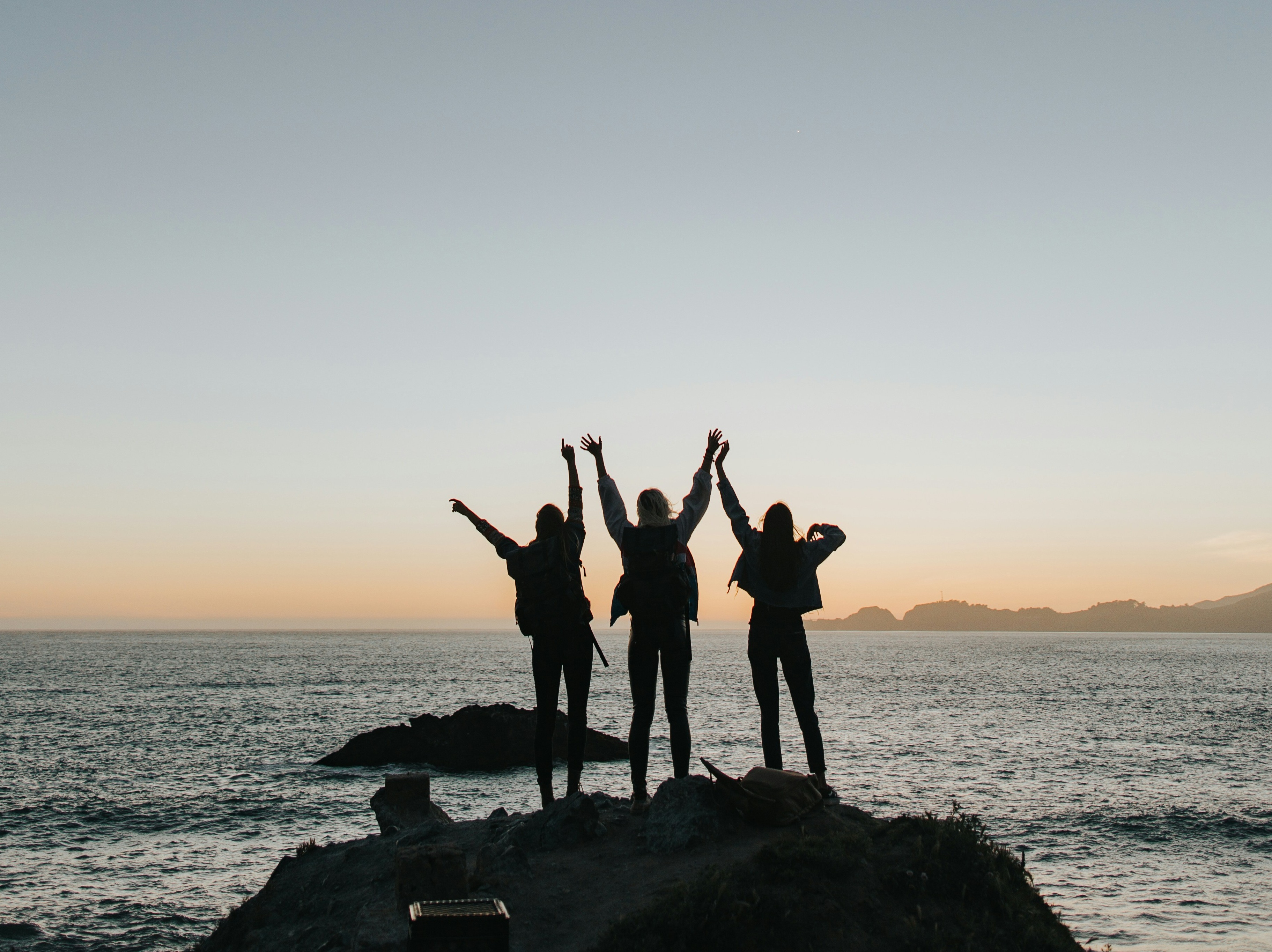 three people jumping